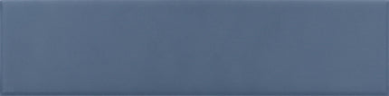 A rectangular blue-gray ceramic tile with a smooth matte finish.
