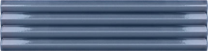 A close-up of five glossy, horizontally aligned ribbed plastic or metal tiles in a muted slate blue-gray color.
