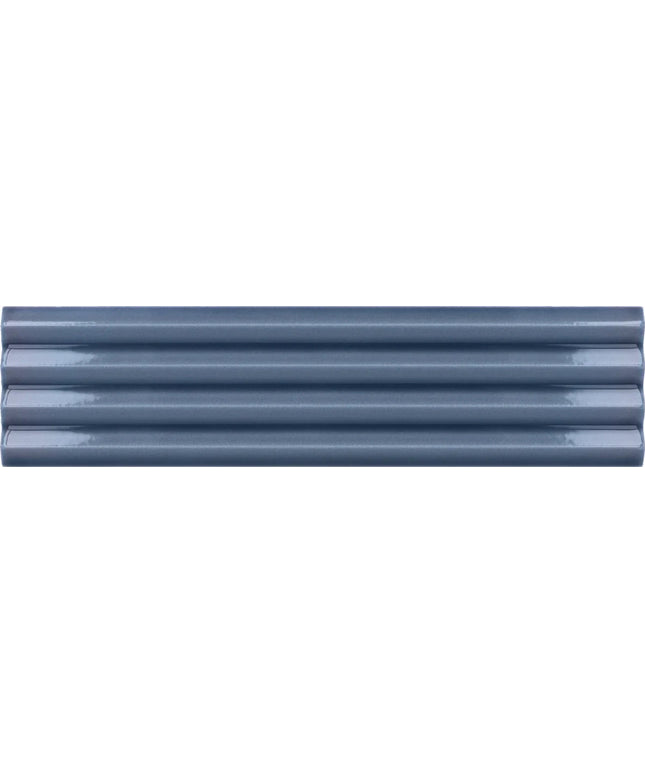 A close-up of five glossy, horizontally aligned ribbed plastic or metal tiles in a muted slate blue-gray color.