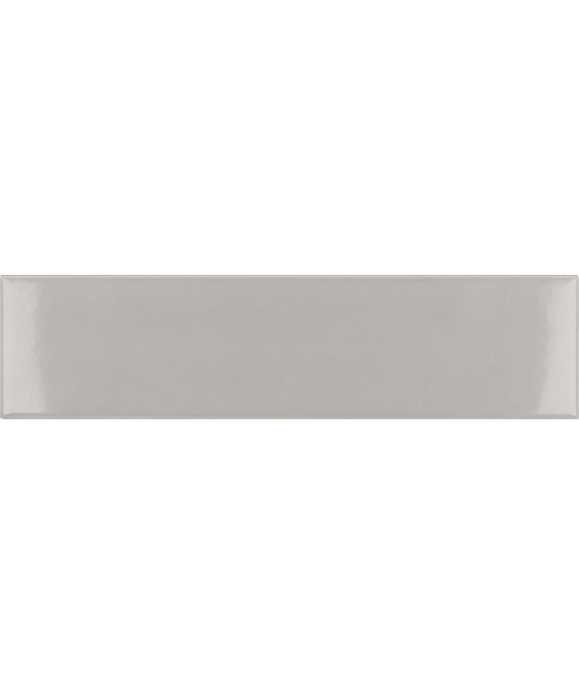 A rectangular glossy ceramic subway tile in a light warm gray or greige color, shown flat against a matching background.