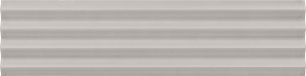 A close-up of a light gray ribbed or corrugated material surface with horizontal ridges.