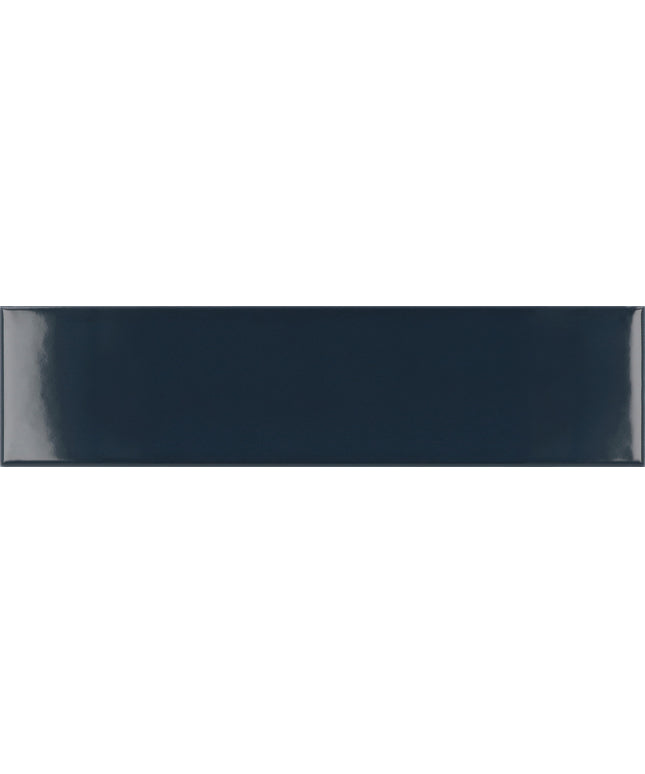A glossy rectangular ceramic tile in a deep navy blue color, shown with a subtle gradient and light reflection on the left side.