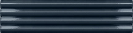 A close-up of dark navy blue corrugated plastic or metal siding panels, showing the horizontal ridges and glossy finish.