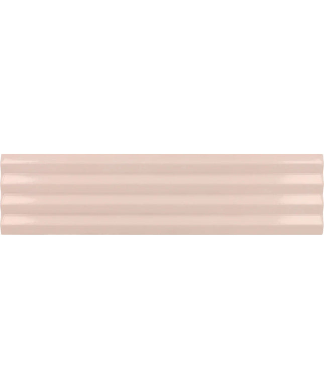 A close-up of a glossy, horizontally grooved ceramic tile in a light blush pink color.