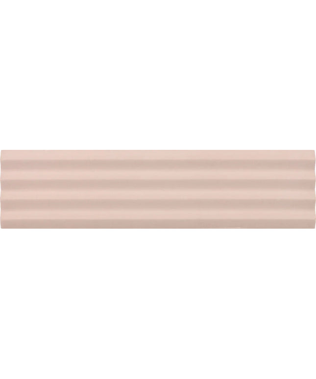 A close-up of a smooth, pale blush pink surface with subtle horizontal ridges.