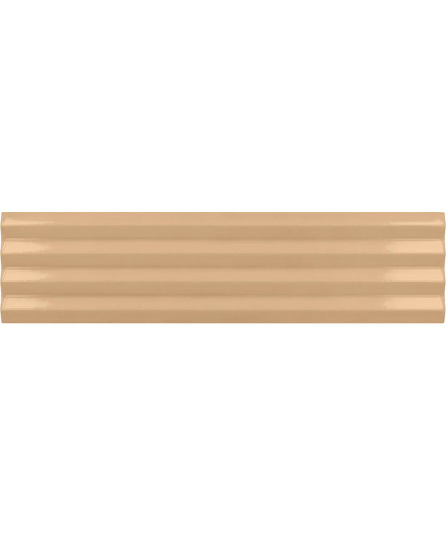A close-up of a glossy, ribbed beige surface, likely a ceramic or porcelain tile, showing horizontal grooves and a warm sandy color.