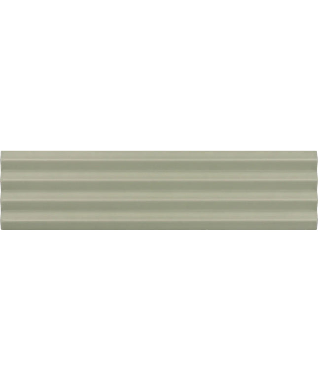A close-up of a ribbed, textured surface in a muted sage green color.