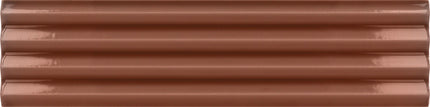 A close-up of a glossy, horizontally grooved brown surface, likely a ceramic or porcelain tile sample.