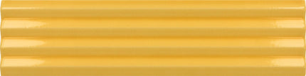 A close-up of a glossy yellow ribbed surface, likely a material or color swatch.