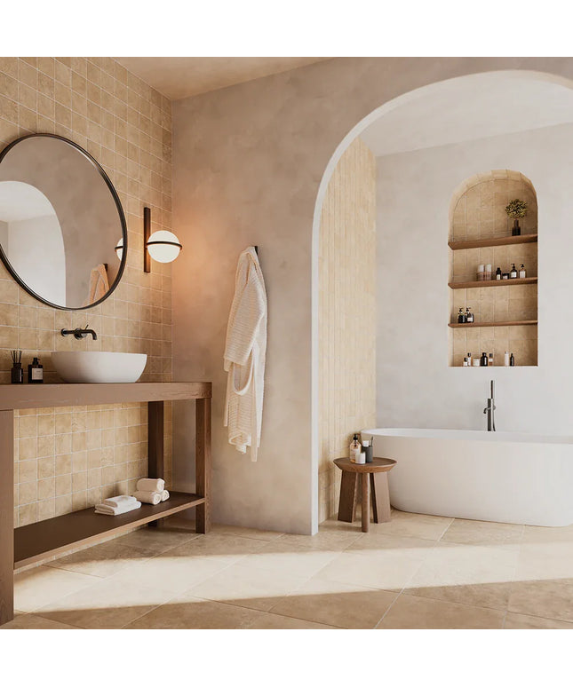 Modern bathroom with a sink, mirror, and bathtub.
