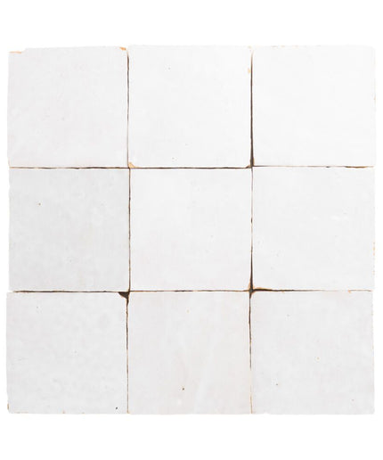 White ceramic tile with brown grout on a white background