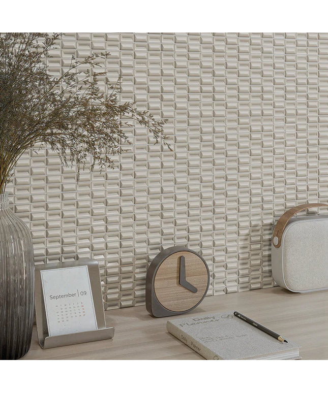 Decorative items including a clock, calendar, notebook, and pen on a textured wall background.