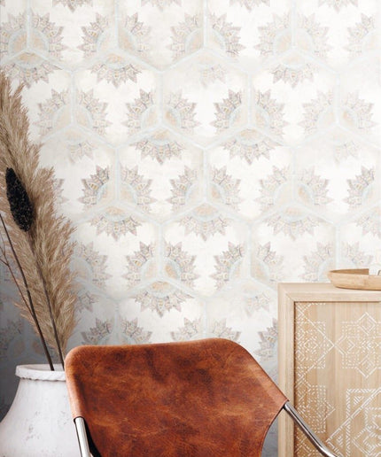 Hexagon floral patterned tile wall with neutral decor and leather chair