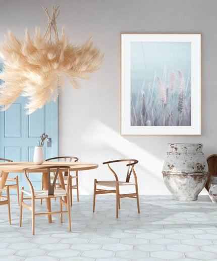 Modern kitchen with light hexagon tile floor, wooden dining set, rustic vases, and wall art