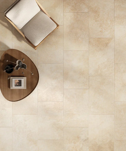 Beige tiles with a small round table and chair in the corner
