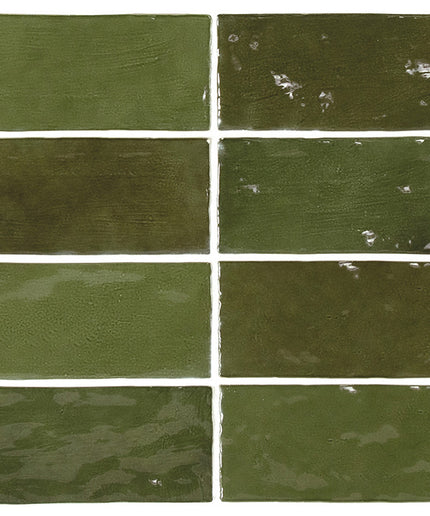 Nine green ceramic tiles of varying shades on a white background