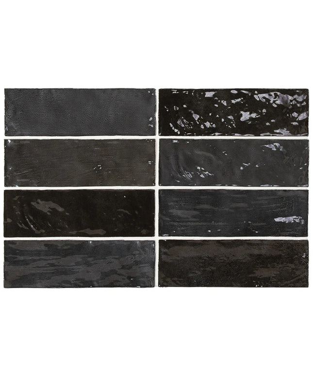 Nine black rectangular tiles with varying textures and finishes.