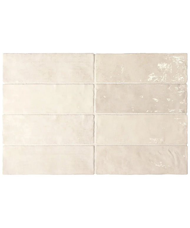 Set of six beige ceramic tiles with subtle patterns on a white background