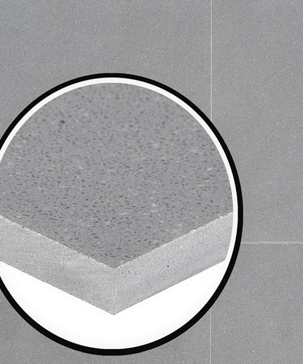 Close-up of a concrete surface with a circular inset on a gray background