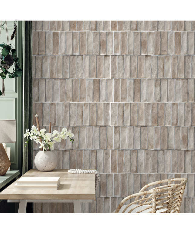 Cream rectangular wall tiles in a modern home office with a rattan chair and desk decor