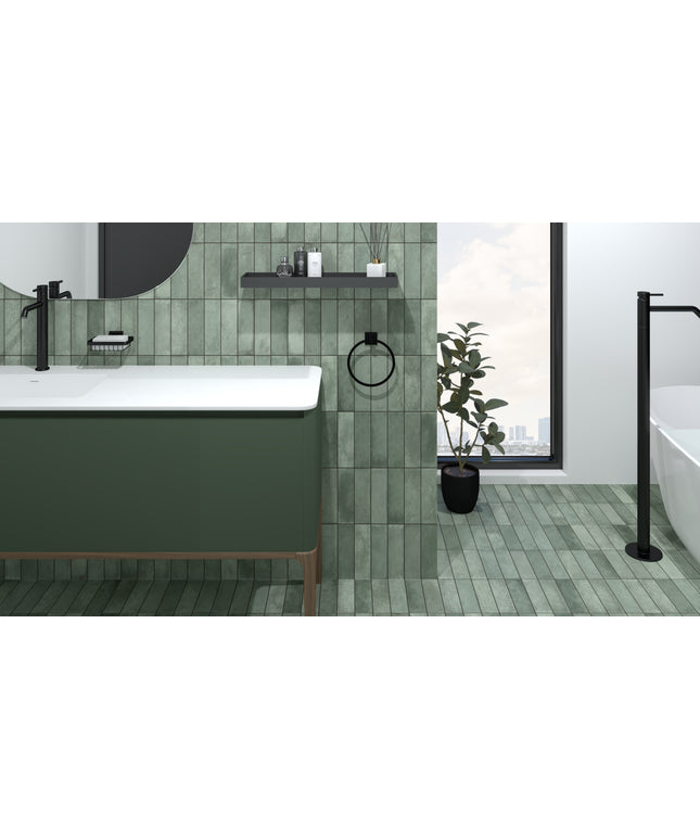 Modern bathroom with vertical green tiles, floating vanity, black fixtures, and large window.