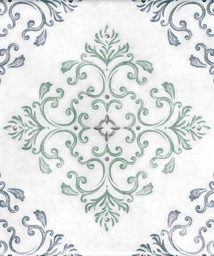 Decorative ceramic tile with intricate green and blue floral scroll design on a white background