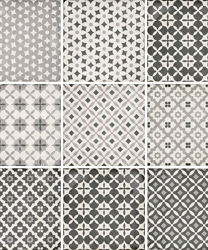 A 3x3 grid of nine square tiles, each showing a different geometric and floral pattern in shades of gray, white, and light gray.