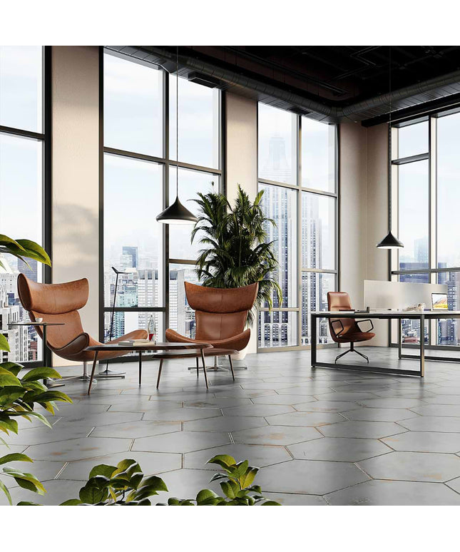Modern office space with large windows, chairs, and a desk.