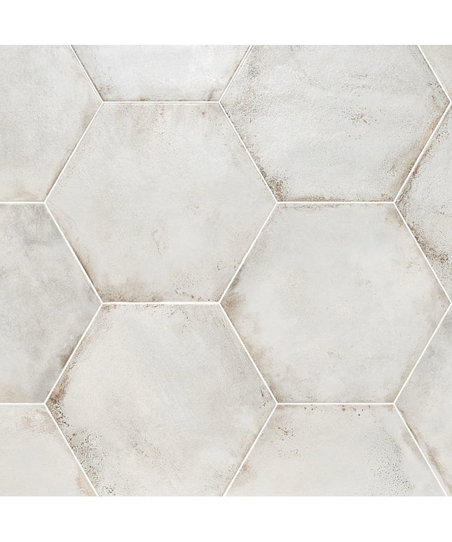 Hexagonal tiles with a light gray and beige pattern