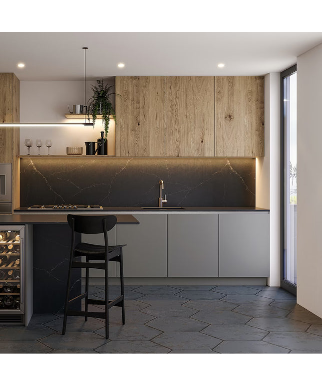 Modern kitchen with wooden cabinets, marble backsplash, and bar stools.