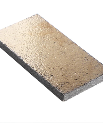 Rectangular stone with two-tone color pattern on a white background