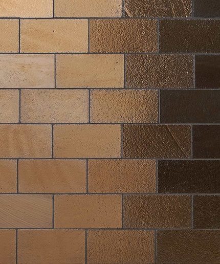 Pattern of brown and beige rectangular tiles