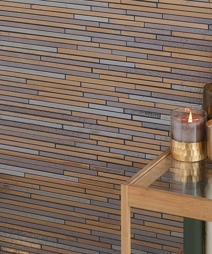 Wooden wall with a brick pattern and candles on a table.