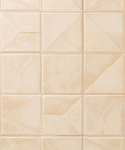 Beige tiles with a geometric pattern on a tiled wall
