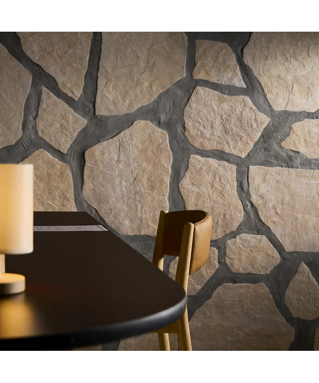 Stone wall with a table and chair in the foreground