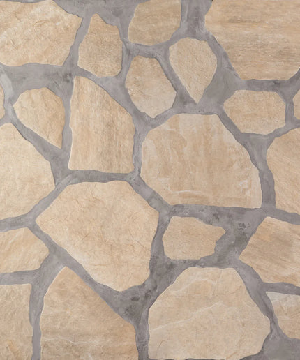 Close-up of a stone-patterned surface with beige and brown stones.