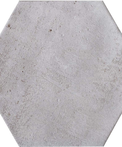 Hexagonal concrete tile with a gray finish on a white background