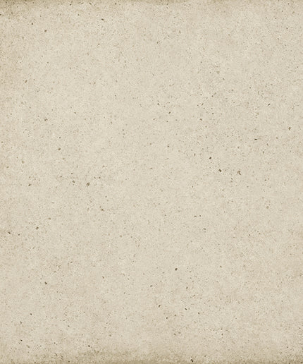 A square textured beige tile or stone surface with a distressed, vintage border and speckled finish.