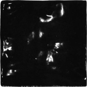 Glossy black 5x5 ceramic tile with reflective surface, ideal for backsplash or shower walls.