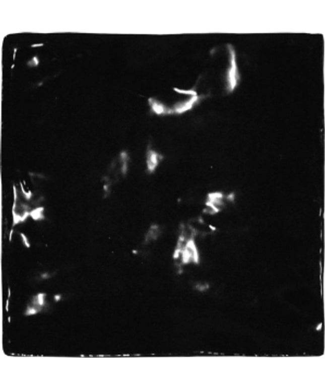 Glossy black 5x5 ceramic tile with reflective surface, ideal for backsplash or shower walls.