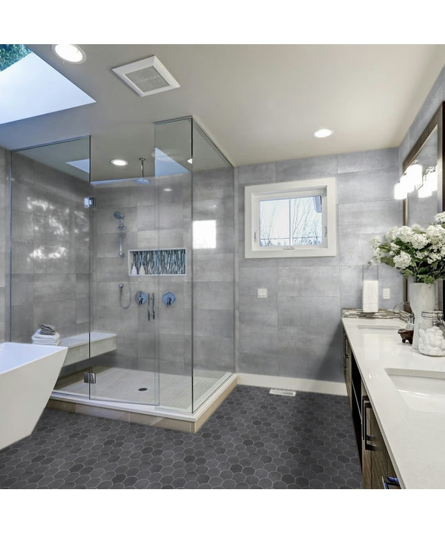Modern bathroom with glass shower enclosure, bathtub, and vanity area.
