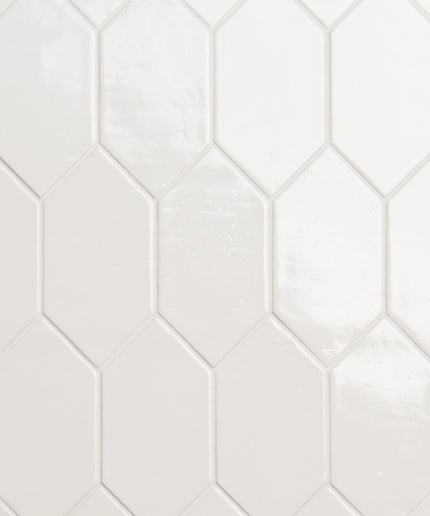 Hexagonal white tiles with a subtle pattern on a white background