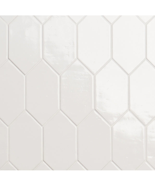 Hexagonal white tiles with a subtle pattern on a white background