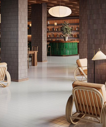 Modern interior with wicker chairs, wooden floor, and a bar area.