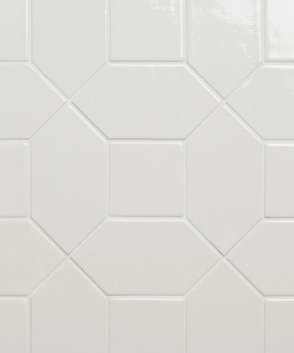 Hexagonal white tiles arranged in a pattern on a light gray background
