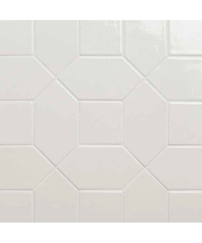 Hexagonal white tiles arranged in a pattern on a light gray background