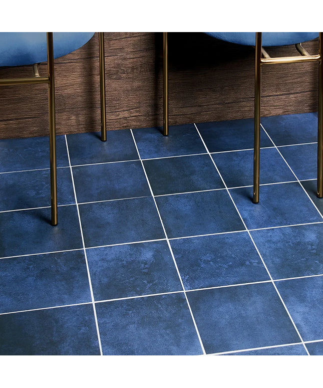 Blue tiled floor with wooden furniture legs visible