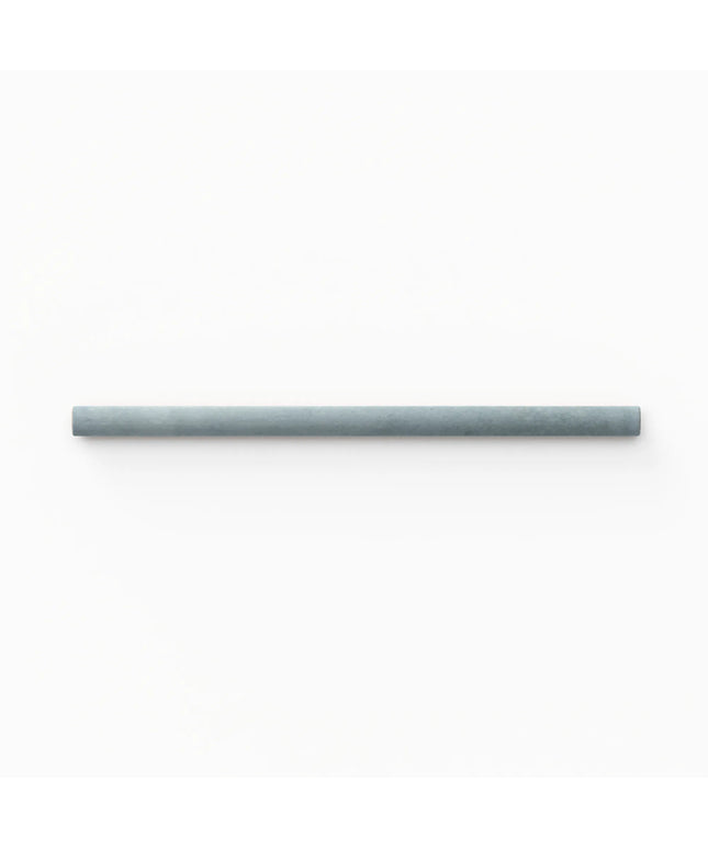 A single long, slim cylindrical product in a muted blue-gray color, positioned horizontally against a solid white background.