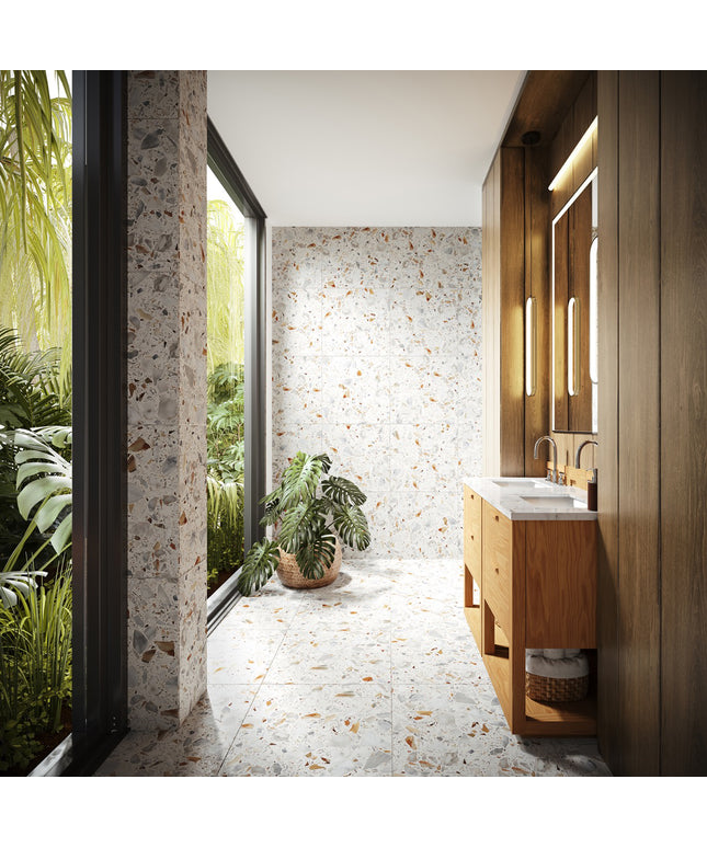 Modern bathroom with wooden vanity, mirror, and plants near a window with a view of greenery.