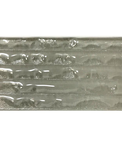 Glossy rectangular glass tile with subtle wave pattern, ideal for modern backsplash or shower walls.